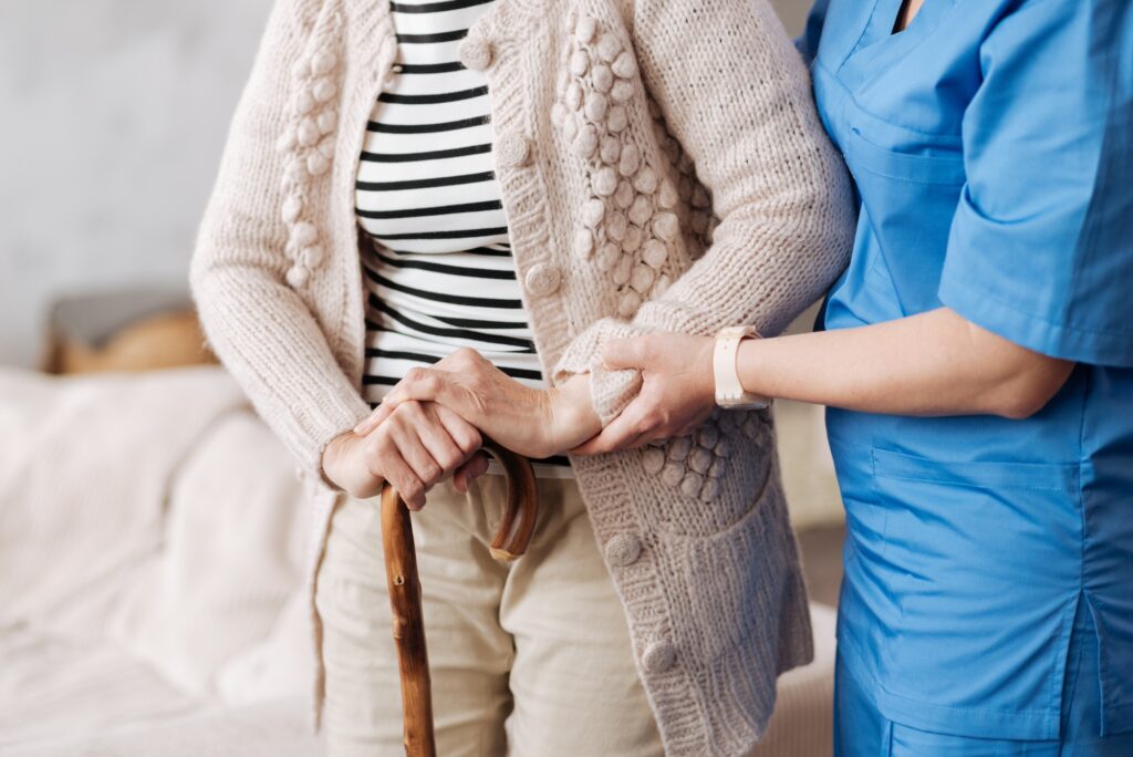 senior with caretaker preparing home for safety and fall prevention to age in place