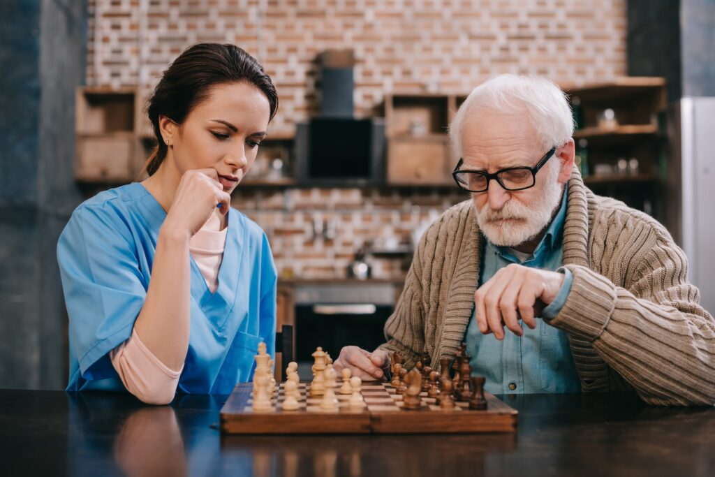 Caregiver providing companionship for senior - how social engagement combats loneliness and improves quality of life, well-being and health.
